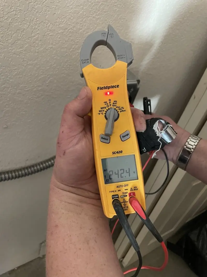 Voltage testing with clamp meter during Ceiling Fan Installation in Ballenger Creek